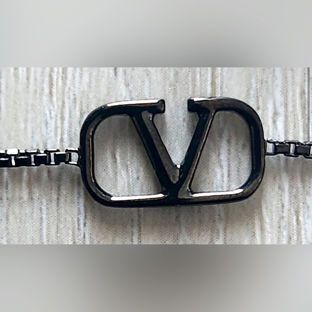 Valentino gun metal bracelet, signature V